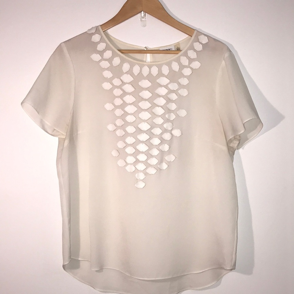 White blouse with leather detail